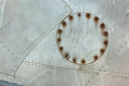 Close up of old aircraft aluminum hatch with rivets.の写真素材
