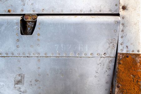 Close up of old aircraft aluminum texture with rivets.の写真素材