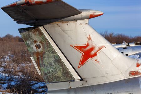 Close up of old aircraft tail with USSR star.の写真素材