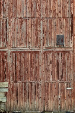 Close up of an old wooden barn door.の写真素材