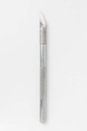 Metal designer scalpel knife isolated on white background.の写真素材