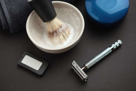 Set of accessories for classic men's wet shaving on black background.の写真素材