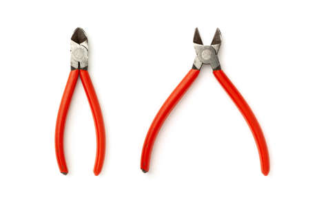 Old wire cutters with red handle isolated on white background.の写真素材