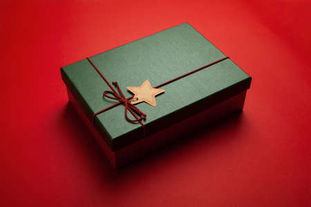 Green present or Christmas box on a red background.の写真素材