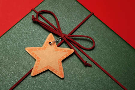 Green present or Christmas box on a red background.の写真素材