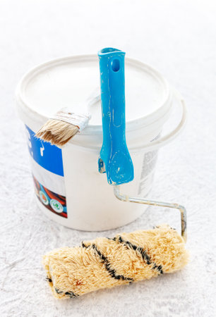 Paint bucket with roller brush on white background.Renovation concept.の写真素材