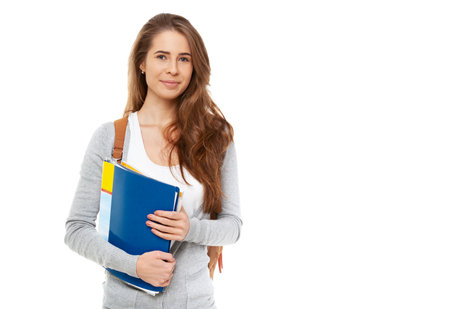 Young happy female student isolated on white background.の写真素材