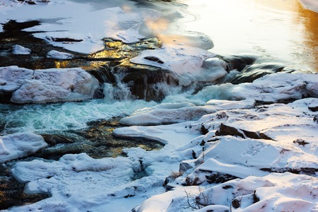 Cracked ice on the river - winter scenery