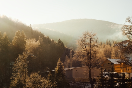Wooden cottage in the mountain valley - winter sceneの写真素材