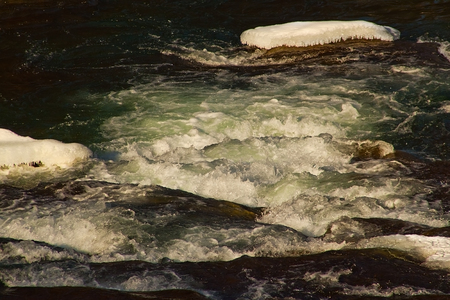 Cracked ice on the river - winter sceneryの写真素材