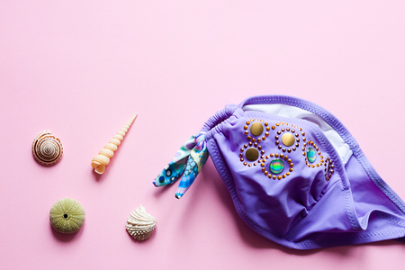 Swimsuit on pink background - pop art concept design, minimalism, flat layの写真素材