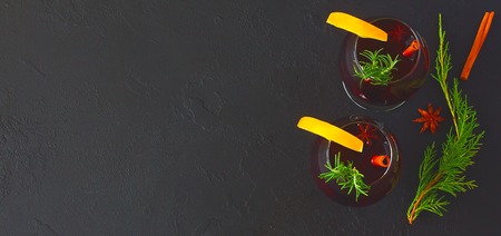 Christmas mulled wine on dark background with decoratons - beautiful Christmas concept with copy space, top viewの写真素材