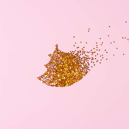 Christmas tree made of golden confetti on pink background. Christmas, winter, new year concept. Banner, card mockup. Flat lay, top view, copy spaceの写真素材