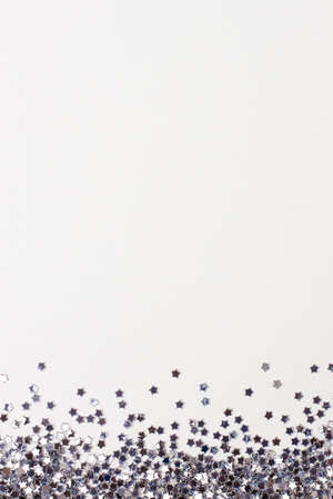 Silver confetti on white. Colorful Christmas or holiday backgroundの写真素材