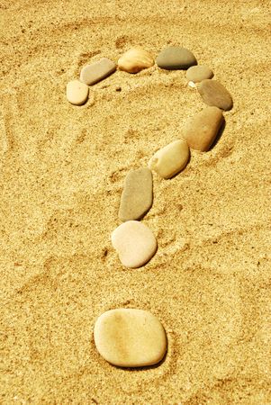 Stones on sea sand, a backgroundの写真素材