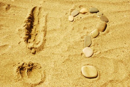 Stones on sea sand, a backgroundの写真素材