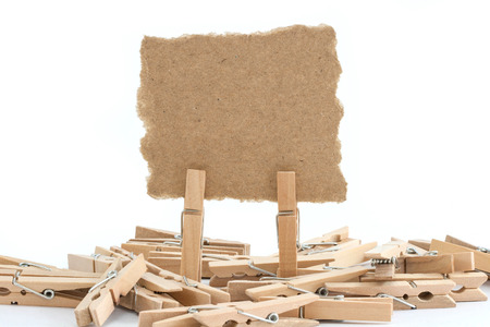 close up of a notes and a clothes pegs on white backgroundの写真素材