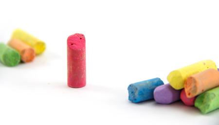 Less chalk in a variety of colors arranged on a white background.の写真素材