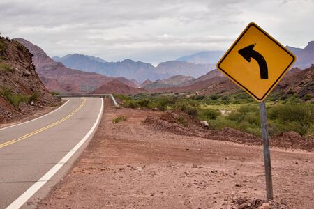 an arrow indicates the way to the mountainsの写真素材