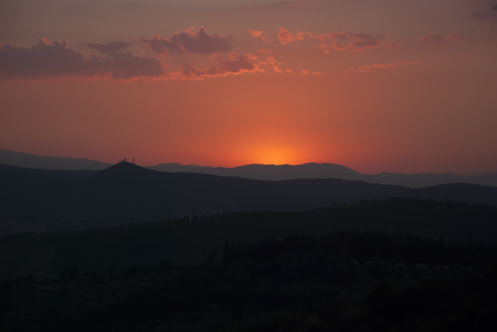 sunset in tuscany, dark, mountainsの写真素材