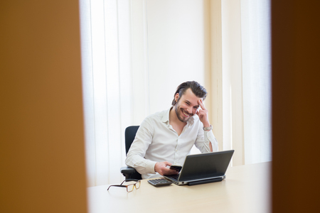 young business man smiling, office, workの写真素材