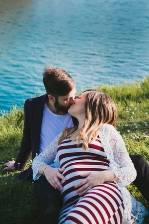 portrait of a pregnant woman by the riverの写真素材