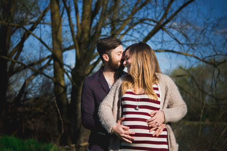 young couple attended child outdoor, outdoorの写真素材