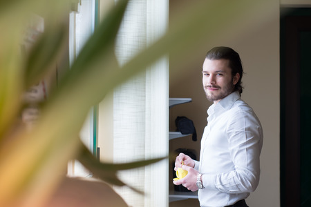 businessman has a coffee break in officeの写真素材