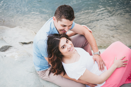 couple expecting a baby, outsideの写真素材