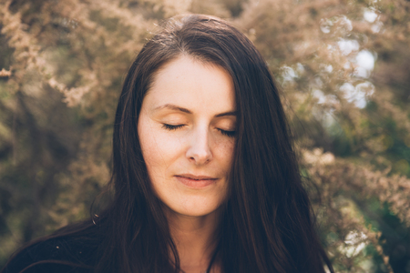 portrait, woman, trees backgroundの写真素材