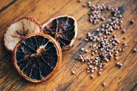 dried slice of orange in wooden backgroundの写真素材