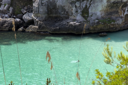 Turquoise water at the Mediterranean sea You can see someone doing snorkelの写真素材