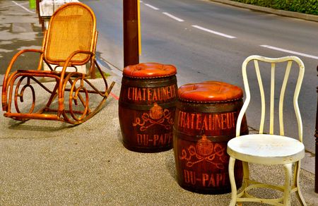 Vintage seats for sale outside of an antique shop in L'Isle-sur-la-Sorgue, Franceの写真素材