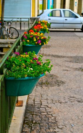 Flower pots adorning a street in L'Isle-sur-la-Sorgue, Franceの写真素材