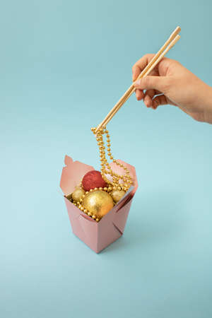 Christmas and chinese new year scene, creative snow man in retro bag with happy red background. Xmas decoration concept with copy space. Minimal colored with simple retro pop art decoration.の写真素材