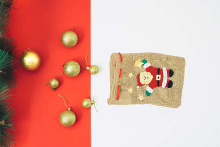 Christmas and chinese new year scene, creative snow man in retro bag with happy red background. Xmas decoration concept with copy space. Minimal colored with simple retro pop art decoration.の写真素材