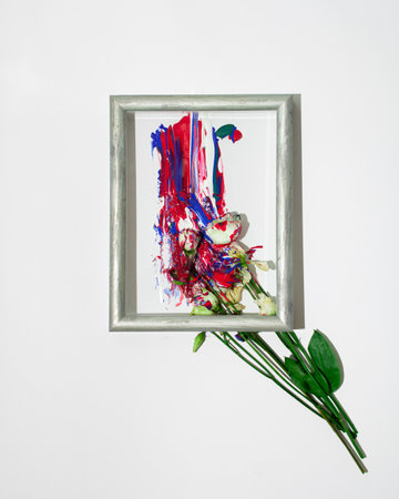 Creative spring concept made. Bouquet of flowers as paint brush and colorful roses on white...