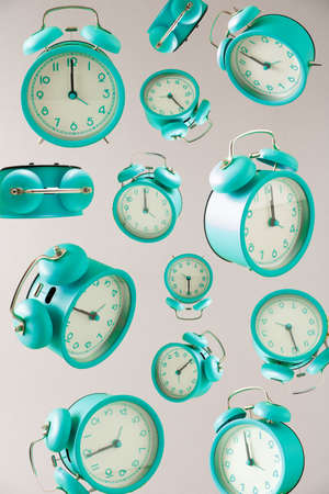 Trendy retro clock alarm pattern on modern beige background. Time passing by.
