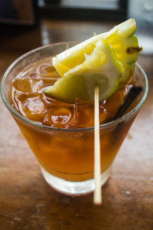A whiskey based cocktail, with lime and pineappleの写真素材
