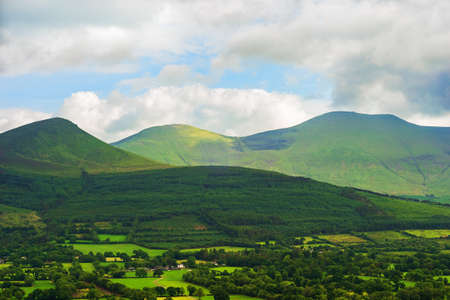 View of Galteemore and the beautiful Galtee Mountains in Tipperary, Ireland, taken from the Glen of Aherlow.の写真素材