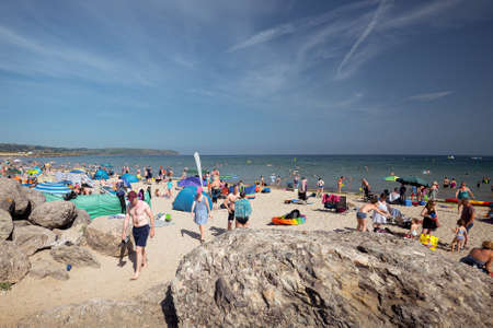 A full Clonea beach, County Waterford, Ireland, on a hot summer day.のeditorial素材