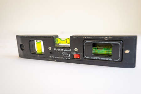 Spirit level. Small, mini, pocket sized. Isolated on white background. Used in construction jobs.