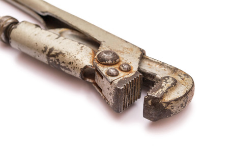 Old pipe wrench some rust isolated on a white background.の写真素材