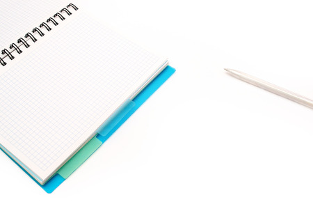 paper notebook with blue elements. Pen with notebookの写真素材
