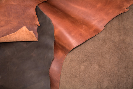 Texture of pieces brown leather. Natural material background