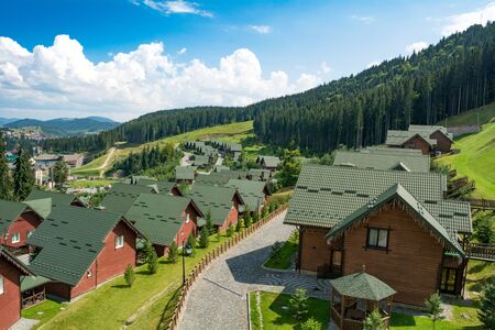 Bukovel, Ukraine - August 21, 2018: Wooden houses in the ski resort. Summer holidays in the Carpathian mountainsのeditorial素材