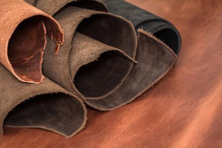Rolls of natural brown and black leather. Materials for leather craft.の写真素材
