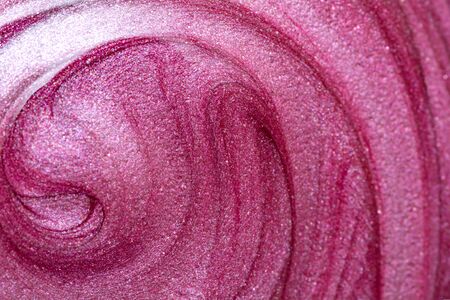 Texture of lip gloss. Smudged pink lipgloss.の写真素材