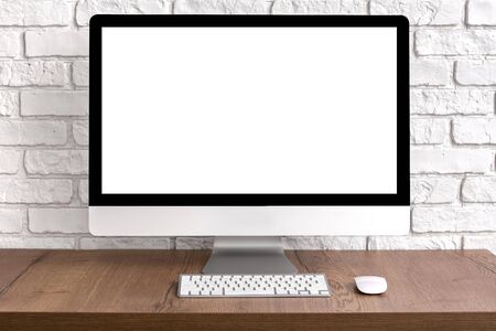 Mock up blank screen computer desktop with keyboard and mouse on wooden table. Work place concept.