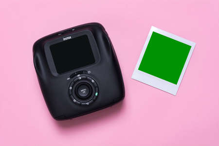 Kyiv, Ukraine - 25 May 2020: Fujifilm Instax Sq 20 Black on a pink background with photo card mockupのeditorial素材